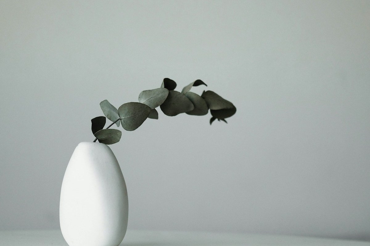 Hand-dipping ceramic bisqueware into mineral glaze